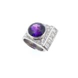 A contemporary amethyst and diamond cluster ring,