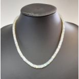 A single row of opal beads,