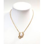 A modern pearl and diamond centerpiece necklace,