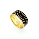 A 19th century memorial ring decorated with black enamel,