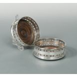 A pair of Victorian silver bottle coasters,