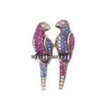 A diamond, sapphire and ruby set parrot brooch,