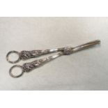 A pair of Victorian silver grape shears with unusual decoration,