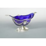 An Edward VII silver pastry basket with blue glass liner,