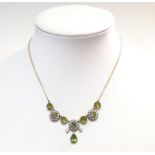 A peridot and seed pearl necklace,