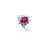 An 18ct gold ruby and diamond cluster ring,