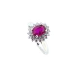 An 18ct gold ruby and diamond cluster ring,