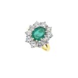 An 18ct gold emerald and diamond cluster ring,