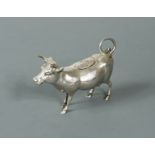 A German metalwares silver miniature semi naturalistic cow creamer,