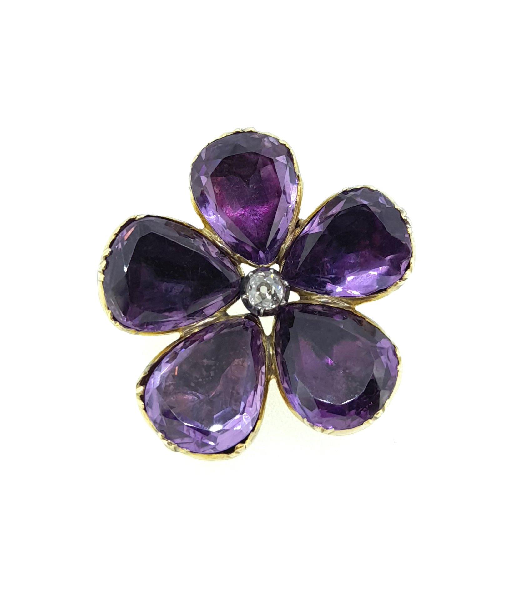 An amethyst and diamond set flower brooch,