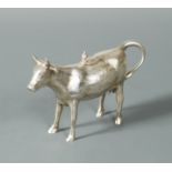 A German metalwares naturalistic cow creamer,
