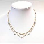 A modern diamond set lattice bib necklace,
