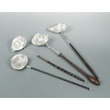 Four punch ladles, one set with a James II coin,