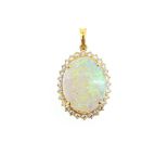 A modern opal and diamond cluster pendant,