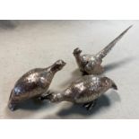 A brace of 20th century cast silver grouse together with a cast silver cock pheasant,