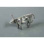 An Italian metalwares silver semi naturalistic cow creamer,