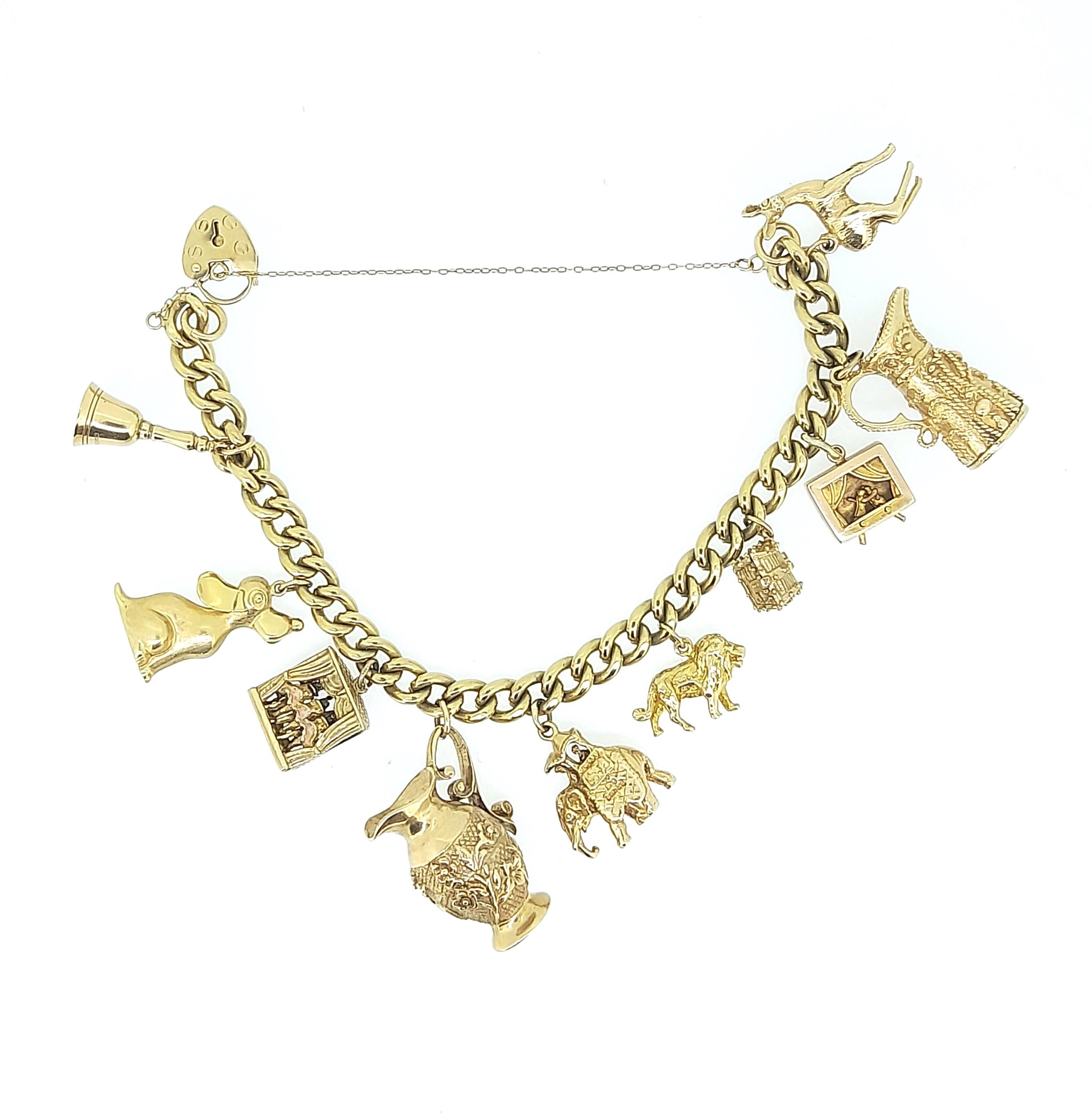 A 9ct gold charm bracelet with many hallmarked charms,