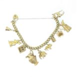 A 9ct gold charm bracelet with many hallmarked charms,