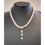 A cultured pearl, diamond and natural fancy coloured diamond pendant necklace,