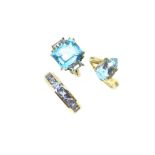 A trio of blue stone gem set dress rings,