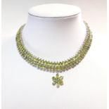 A modern statement collar set with peridot,