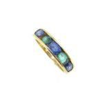 A sapphire and emerald half hoop ring,