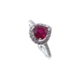 An 18ct gold ruby and diamond cluster ring,