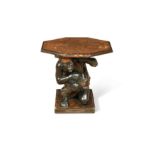 A 19th century Venetian ebonised fruitwood kneeling blackamoor stand,