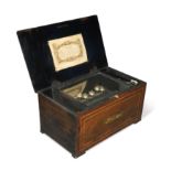 A Swiss rosewood and amboyna banded musical box, 19th century,