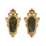 A pair of late 18th or early 19th century Venetian gilt wood wall mirrors,