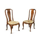 A pair of George I walnut side chairs,