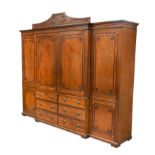 A Regency mahogany and ebony strung breakfront wardrobe, circa 1820,