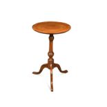 A small George III circular yew side table,