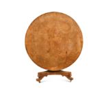 A late Regency pollard oak circular table,