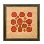 A framed collection of 40 Grand Tour red wax portrait intaglios, 19th century,