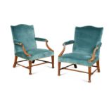 A pair of George III mahogany Gainsborough open armchairs,