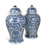 A pair of large Chinese blue and white vases and covers, 20th century,