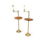 A pair of mahogany and brass adjustable floor lamps