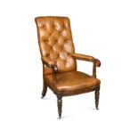 A William IV button back leather armchair,