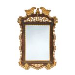 A Portuguese mahogany and carved giltwood wall mirror, 18th century,