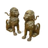 A pair of painted cast iron seated lion firedogs, 20th century,