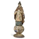 An 18th century carved and polychrome painted model of a Chinaman,