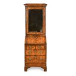 A burr-walnut bureau-cabinet of slender proportions, 18th century,