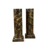 A pair of painted simulated marble classical columns, 20th century,