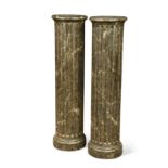 A pair of reeded faux marble painted columns,