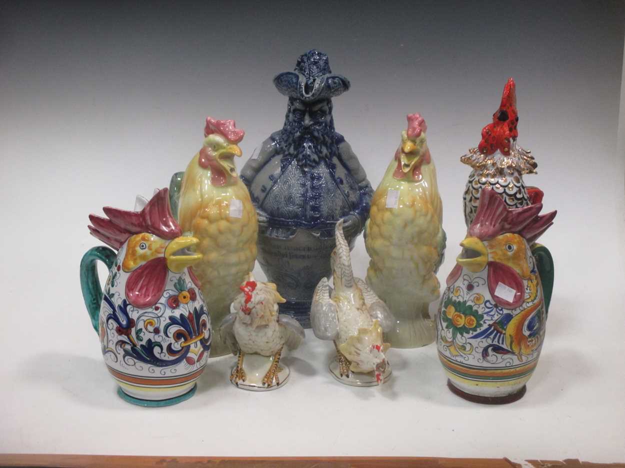 Collection of model china cockerells and a German stoneware rotund figural jug (8)