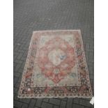 Red ground Persian syle rug, worn in places 187 x 138cm