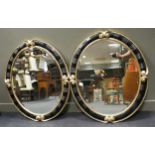 A pair of Christopher Guy oval wall mirrors, 112 x 92cm