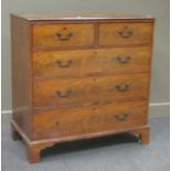 A George III figured mahogany chest of two short and three long drawers, with squared bronzed