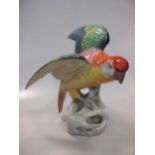 A Copeland Spode porcelain model of a parrot with glass eyes, 29.5cm high